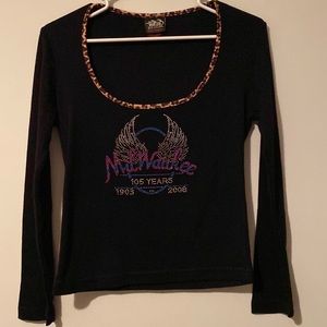 Ladies biker shirt size small with Milwaukee and “Harley” logo. Never worn